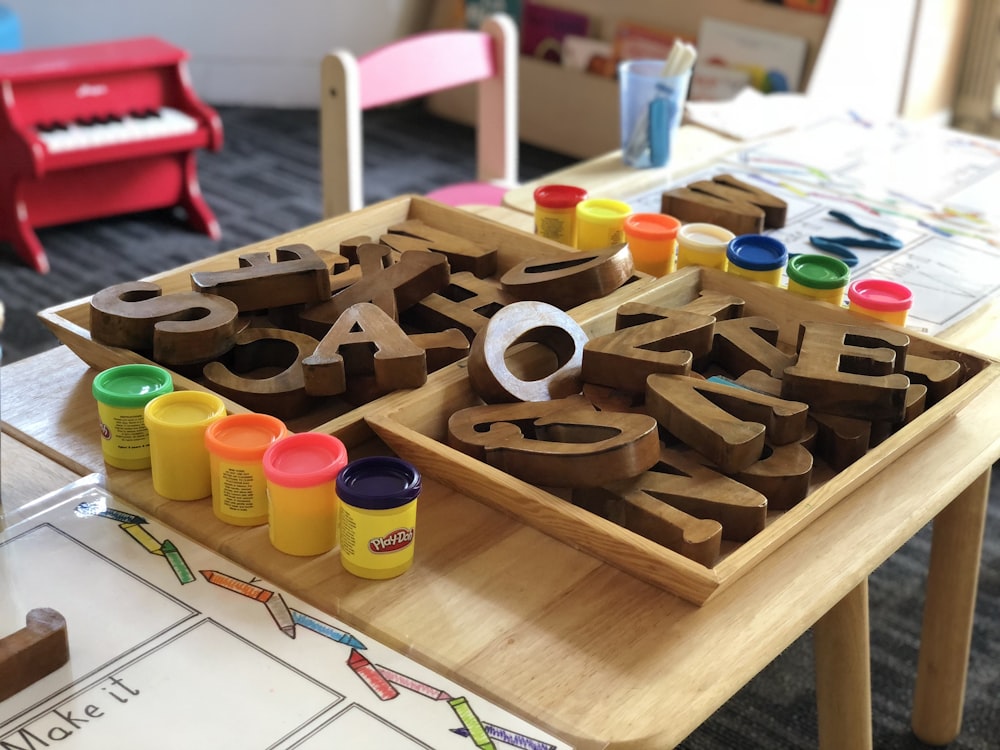 Wooden alphabet letters and modelling clay for early learning