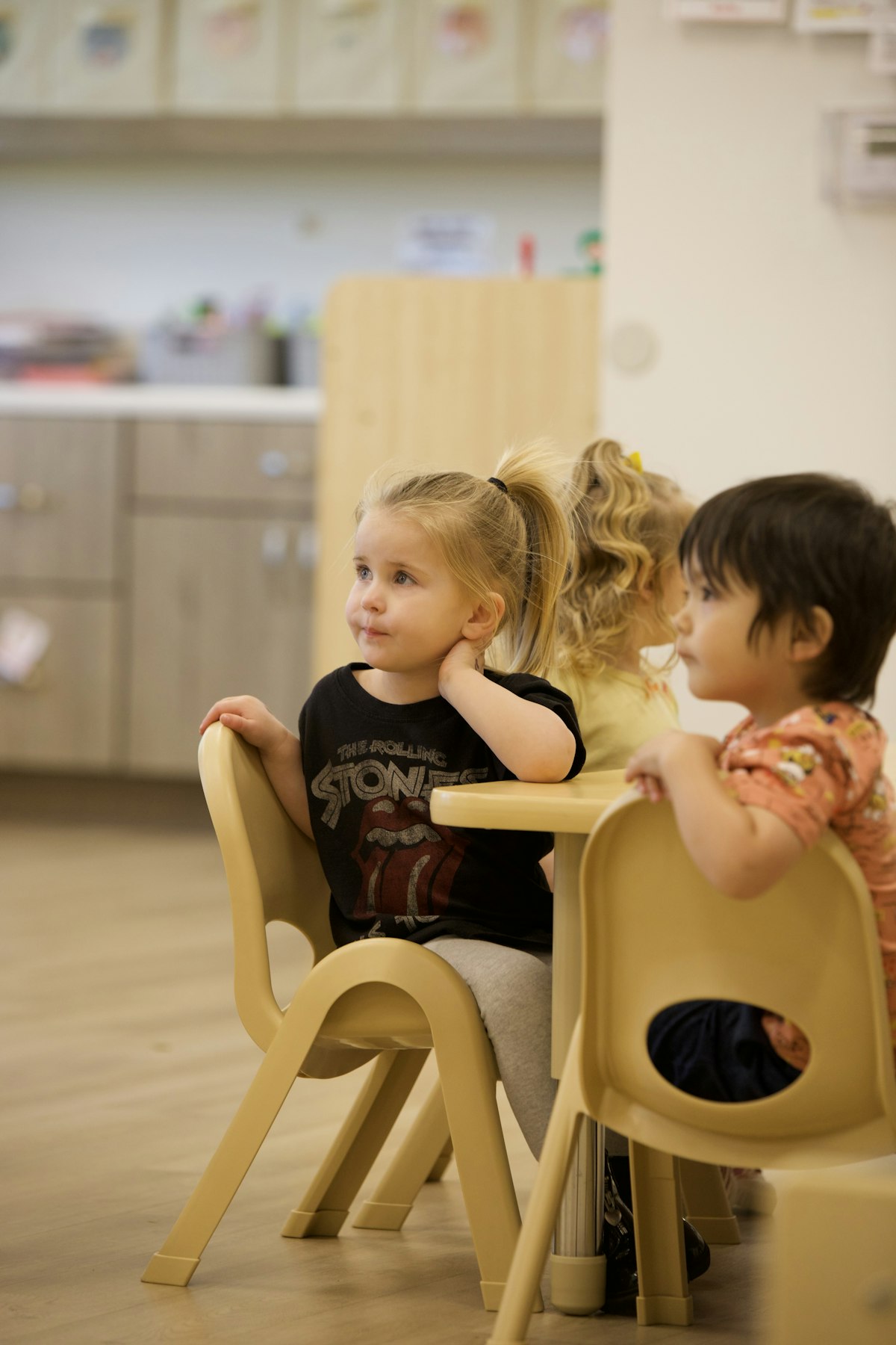 Young children at a classroom table